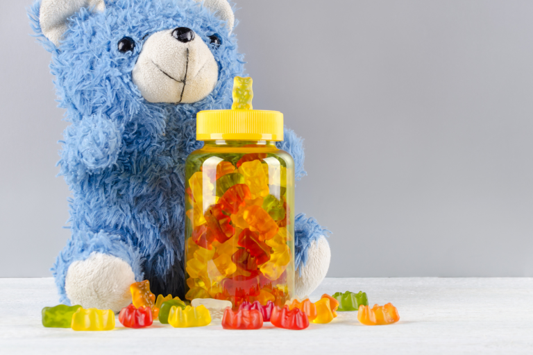 Teddy bear with a bottle of children's vitamins